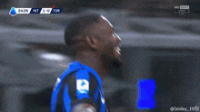 a soccer player with the number 9 on his jersey celebrates