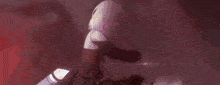 a close up of a person 's face with a pink background