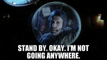 a man in a bubble with the words " stand by okay i 'm not going anywhere "