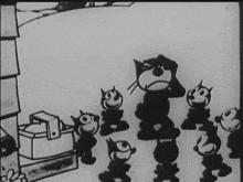 a black and white cartoon of felix the cat and his cats
