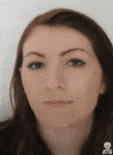 a close up of a woman 's face with a sticker of a man on the bottom right corner