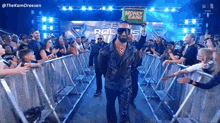 a man holding a sign that says money bank walks through a crowd of people