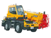 a yellow and black truck with the word kato on the front