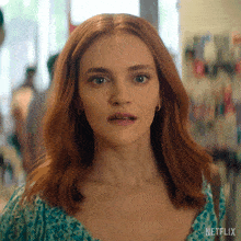 a close up of a woman 's face with netflix written on the bottom right