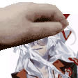 a close up of a person 's hand holding a piece of paper over a person 's head .