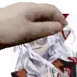 a close up of a person 's hand holding a piece of paper over a person 's head .