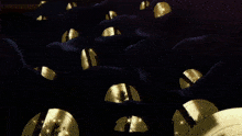 a bunch of gold objects on a wooden shelf