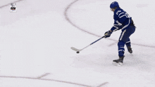 a hockey player with the number 91 on his jersey is holding a hockey stick