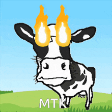 a black and white cow with flames coming out of its eyes