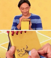 a man in a blue and white striped shirt is holding a yellow notepad that says need dat .