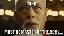 a man with a beard is looking at the camera with the words mind must be master of the body above him .