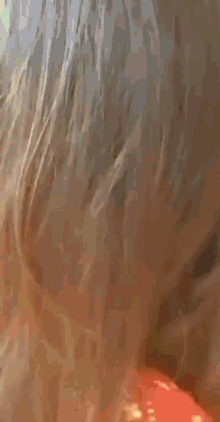 a close up of a person 's face with a blurred image