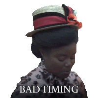 a woman wearing a hat with the words bad timing written on it