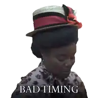 a woman wearing a hat with the words bad timing written on it