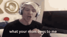 a man wearing headphones is screaming and says what your mom does to me