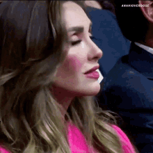 a close up of a woman 's face with the hashtag anahioverdose on the bottom