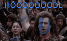 a man with blue paint on his face is screaming in front of a crowd that says hooooooodl