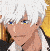 a man with white hair and blue eyes is smiling