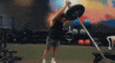 a man is lifting a barbell over his head
