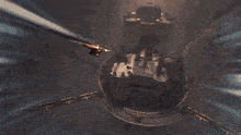 a video game character is flying around a circular object with a sword coming out of it .