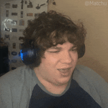 a man wearing headphones with the hashtag @matchu on the bottom