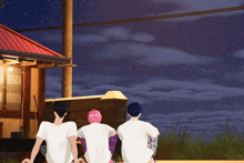 a group of people sitting in front of a house looking at the stars