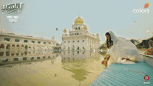 a woman in a white dress with a veil on her head is being advertised for colors