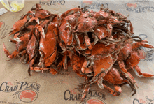 a bunch of crabs are sitting on a crab place paper