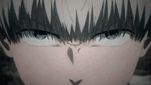 a close up of a person 's face with a very angry expression