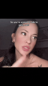 a woman with a tattoo on her arm says " so you 're scared to talk to girls "