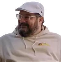 a man with a beard and glasses wearing a white hat