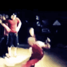 a blurry photo of a group of people dancing