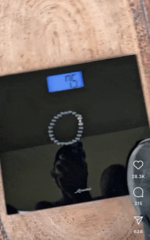 a person 's weight is displayed on a scale
