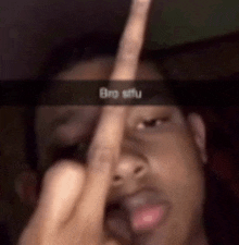 a man is giving the middle finger with a snap that says bro sifu .
