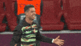 two men are hugging each other on a field