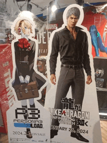 a cardboard cutout of a man and a girl standing next to a sign that says like a dragon infinite wealth
