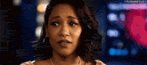 a close up of a woman 's face with a blurry background .