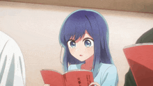 a girl with blue hair is reading a red book