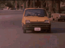 a yellow car with a license plate that says ' sdc ' on it