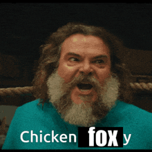 a man with long hair and a beard is screaming with the words " chicken fox y " below him
