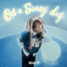 on a sunny day album cover with a man wearing a rabbit hat
