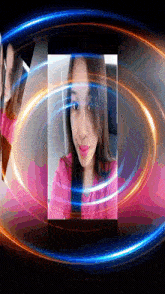 a woman in a pink shirt is surrounded by a circle of lights