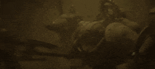 a video game character is holding a spear and has a symbol on his head