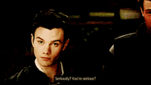 two men are standing next to each other and one of them is asking the other if he is serious
