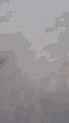 a blurry picture of a person walking down a street