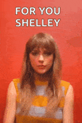 a woman in a yellow and blue striped shirt is making a face and says `` for you shelley '' .