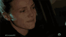 a close up of a woman 's face with #chicagopd written below her