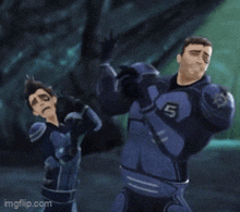 a man in a blue suit with the number 5 on his chest stands next to another man