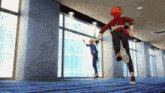 two anime characters are running in a hallway with a blue carpet .