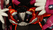 a close up of a toy with a purple glove
